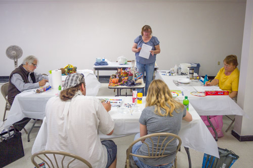Jean Kellogg and her students during one of her acrylic painting classes.